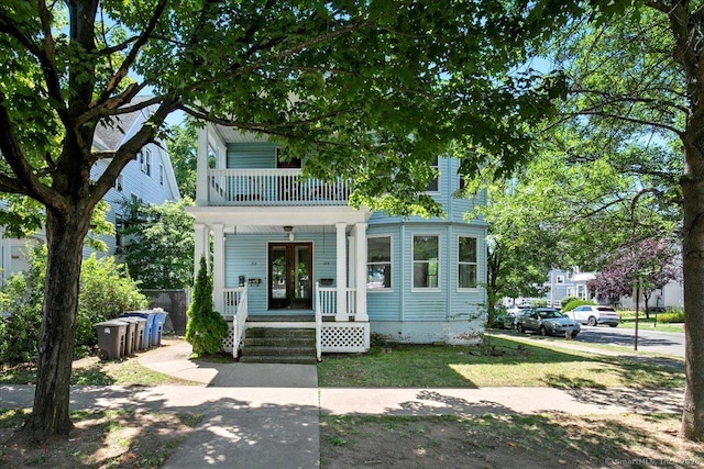212 Maple St, New Haven, CT 06511 - view of front of home featuring a porch, a balcony, and a front yard