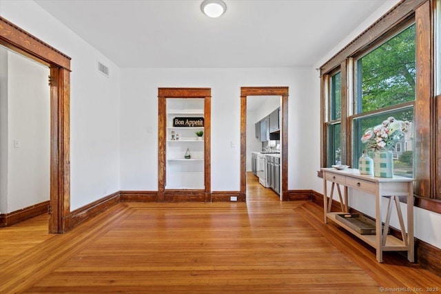 212 Maple St, New Haven, CT 06511 - empty room featuring baseboards and light wood-type flooring
