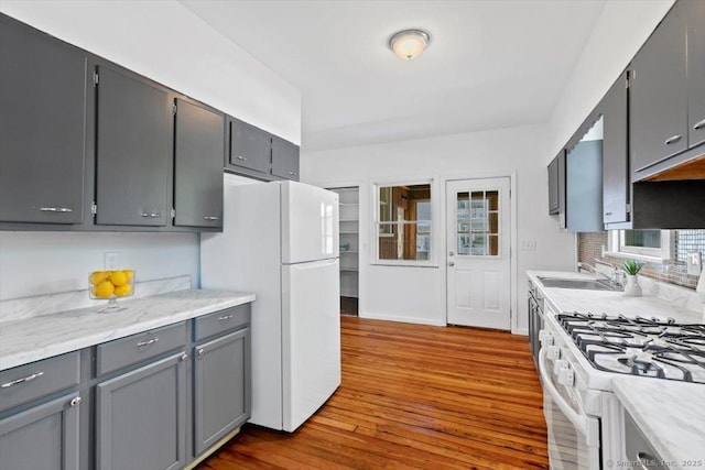 212 Maple St, New Haven, CT 06511 - kitchen with white appliances, dark wood finished floors, tasteful backsplash, and gray cabinetry