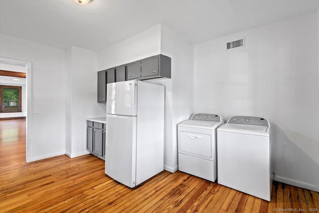 212 Maple St, New Haven, CT 06511 - washroom featuring washing machine and dryer and light wood-style floors