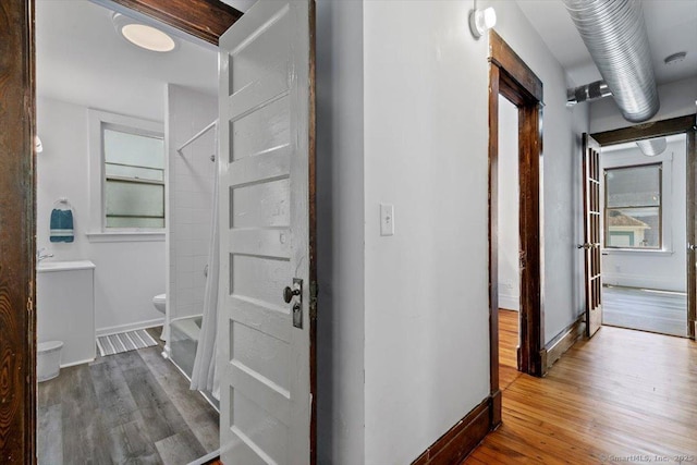 212 Maple St, New Haven, CT 06511 - corridor featuring wood finished floors and baseboards
