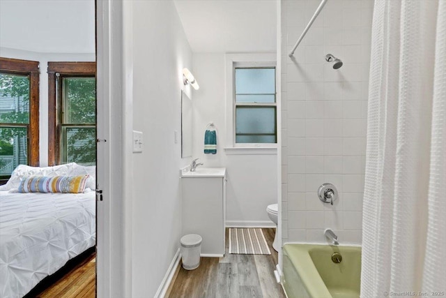 212 Maple St, New Haven, CT 06511 - ensuite bathroom with vanity, wood finished floors, and shower / bath combo with shower curtain