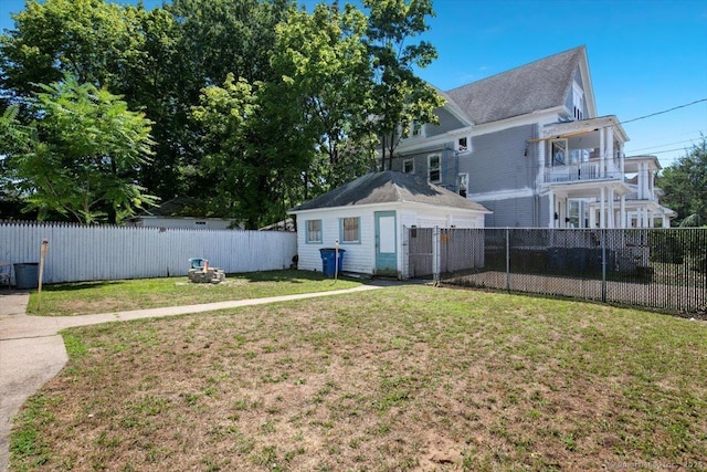 212 Maple St, New Haven, CT 06511 - back of house with a fenced backyard and an outdoor structure