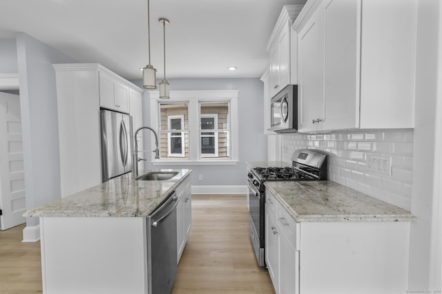 476 Washington Ave, West Haven, CT 06516 - kitchen with stainless steel appliances, a kitchen island with sink, decorative backsplash, white cabinetry, and light stone countertops