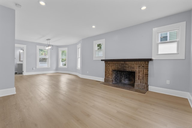 476 Washington Ave, West Haven, CT 06516 - unfurnished living room featuring a fireplace, light wood finished floors, and recessed lighting