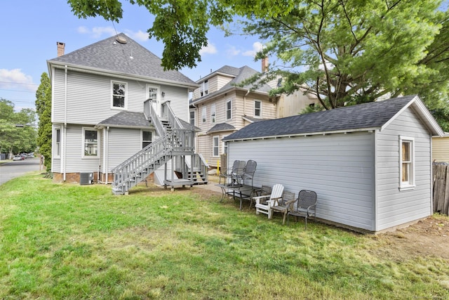 476 Washington Ave, West Haven, CT 06516 - back of house featuring stairway, an outdoor structure, a chimney, and roof with shingles