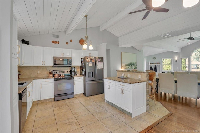 9 Madrina Ln, Madison, CT 06443 - kitchen with appliances with stainless steel finishes, ceiling fan, backsplash, stone countertops, and white cabinets
