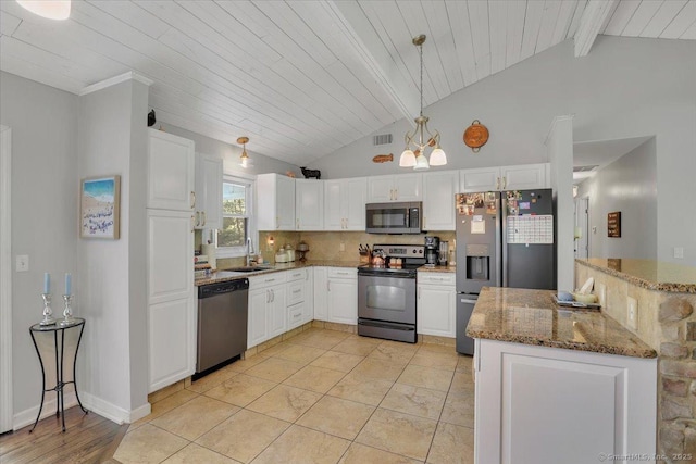 9 Madrina Ln, Madison, CT 06443 - kitchen featuring stainless steel appliances, white cabinets, pendant lighting, decorative backsplash, and stone counters