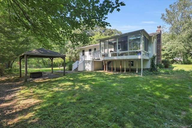 9 Madrina Ln, Madison, CT 06443 - rear view of property featuring a gazebo, a sunroom, stairs, a lawn, and a chimney