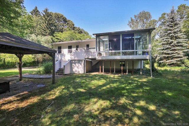 9 Madrina Ln, Madison, CT 06443 - rear view of property featuring stairway, a sunroom, a yard, and a deck