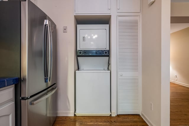 65 Main St Unit 39, Essex, CT 06442 - laundry area with estacked washer and dryer and dark wood-type flooring