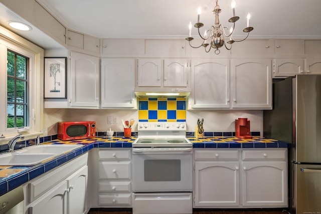 65 Main St Unit 39, Essex, CT 06442 - kitchen with electric range, freestanding refrigerator, white cabinetry, under cabinet range hood, and tile countertops