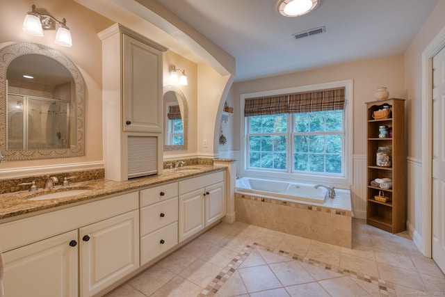 2 Warren Gln, Burlington, CT 06013 - bathroom featuring tile patterned floors, double vanity, a garden tub, and a stall shower