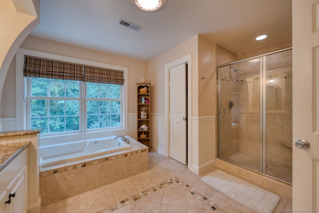 2 Warren Gln, Burlington, CT 06013 - bathroom featuring tile patterned floors, a shower stall, a bath, vanity, and wainscoting