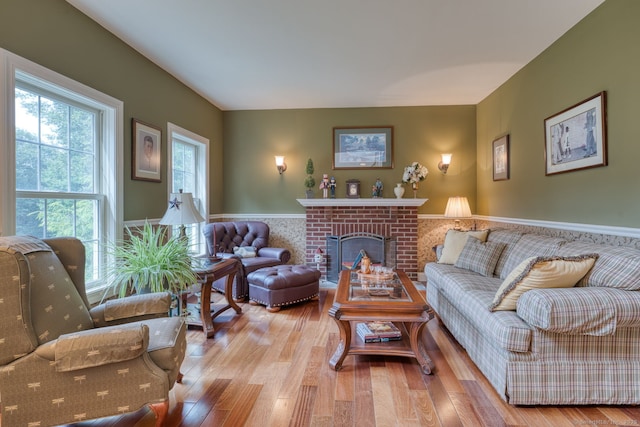 2 Warren Gln, Burlington, CT 06013 - living area with wood finished floors, wainscoting, and a fireplace