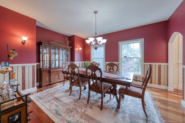 2 Warren Gln, Burlington, CT 06013 - dining room with wainscoting, a chandelier, light wood-type flooring, and arched walkways