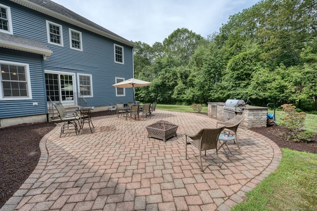 2 Warren Gln, Burlington, CT 06013 - view of patio featuring exterior kitchen, outdoor dining area, and an outdoor fire pit