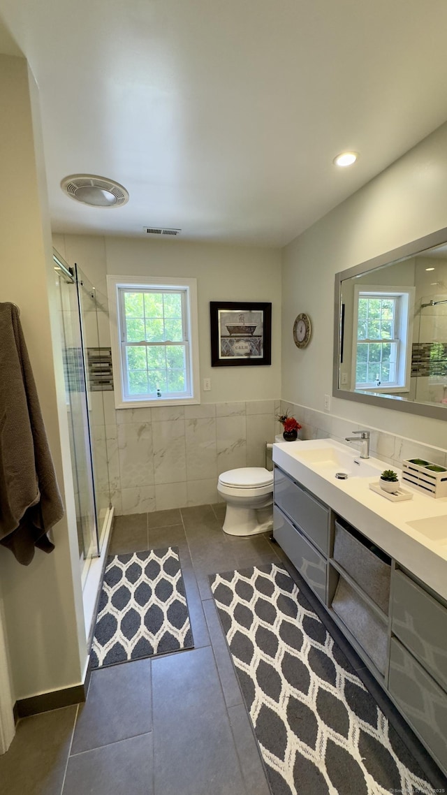 355 Oregon Rd, Cheshire, CT 06410 - full bathroom featuring tile patterned floors, plenty of natural light, a shower stall, double vanity, and tile walls