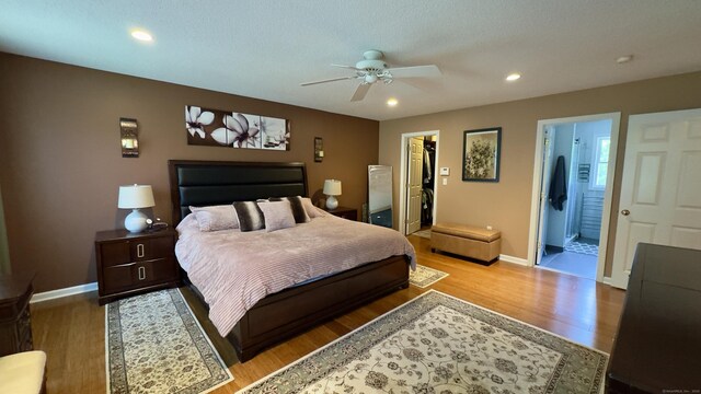 355 Oregon Rd, Cheshire, CT 06410 - bedroom featuring wood finished floors, a walk in closet, recessed lighting, connected bathroom, and a ceiling fan