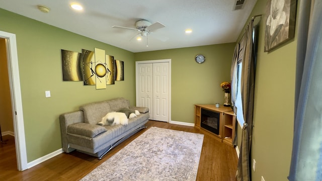 355 Oregon Rd, Cheshire, CT 06410 - living area with a ceiling fan and dark wood-style floors
