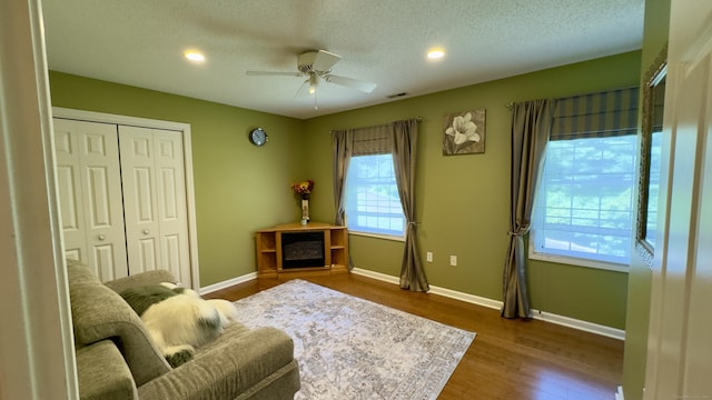 355 Oregon Rd, Cheshire, CT 06410 - sitting room with wood finished floors, a ceiling fan, recessed lighting, and a textured ceiling