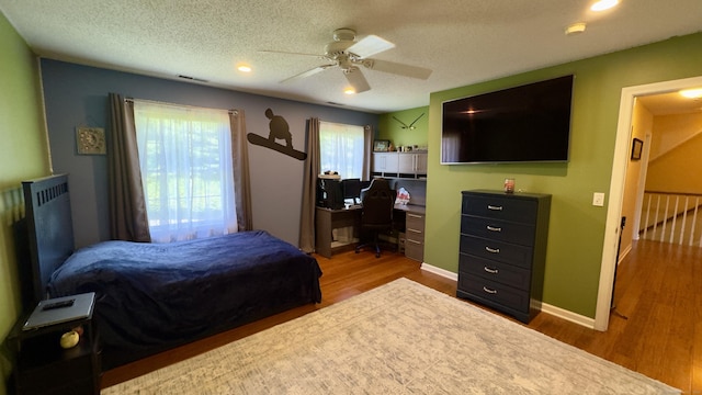 355 Oregon Rd, Cheshire, CT 06410 - bedroom with wood finished floors, an office area, ceiling fan, a textured ceiling, and recessed lighting