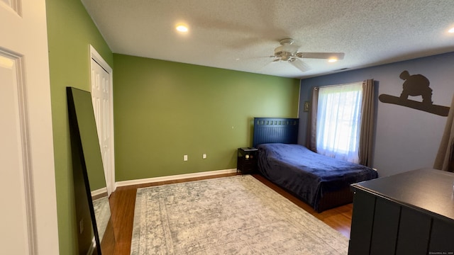 355 Oregon Rd, Cheshire, CT 06410 - bedroom with wood finished floors, recessed lighting, ceiling fan, a textured ceiling, and a closet