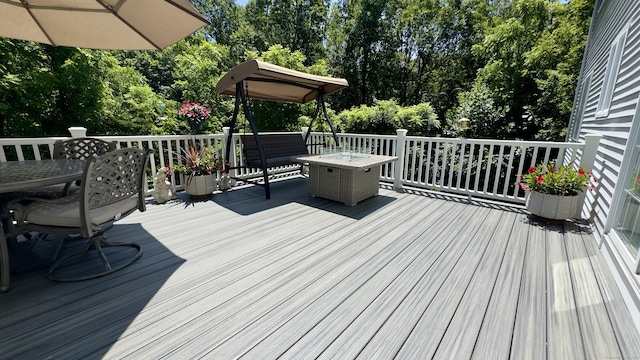 355 Oregon Rd, Cheshire, CT 06410 - wooden terrace featuring outdoor dining space and view of scattered trees