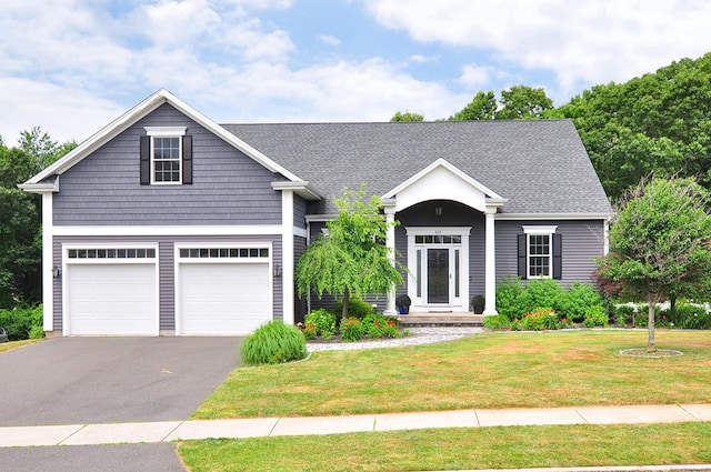 419 Briarwood Dr, Manchester, CT 06040 - traditional-style home with a front yard, driveway, a garage, and a shingled roof