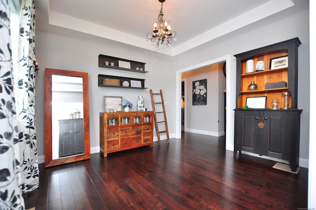 419 Briarwood Dr, Manchester, CT 06040 - foyer featuring a chandelier, dark wood-style floors, and a raised ceiling