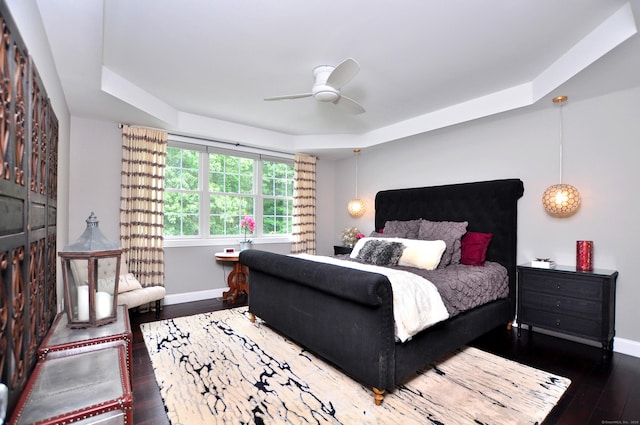 419 Briarwood Dr, Manchester, CT 06040 - bedroom featuring hardwood / wood-style flooring, a tray ceiling, and ceiling fan