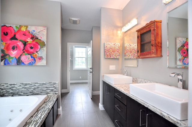 419 Briarwood Dr, Manchester, CT 06040 - bathroom with double vanity, tile patterned flooring, and a tub with jets