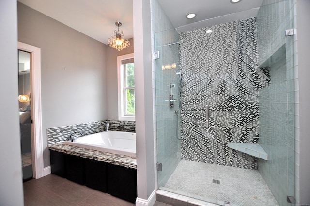 419 Briarwood Dr, Manchester, CT 06040 - full bath featuring a garden tub, a stall shower, a chandelier, tile patterned flooring, and recessed lighting