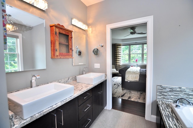 419 Briarwood Dr, Manchester, CT 06040 - ensuite bathroom featuring double vanity, a bathtub, and a ceiling fan
