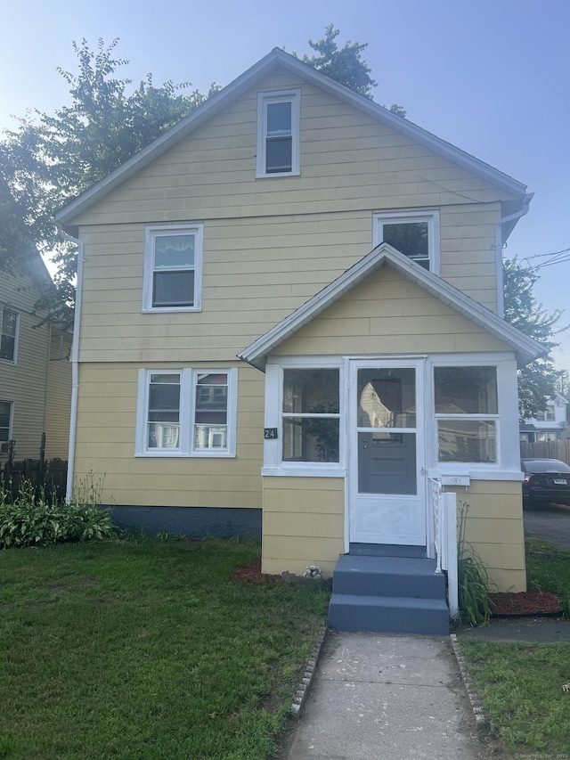 24 Daniel St, East Hartford, CT 06108 - american foursquare style home with a front lawn