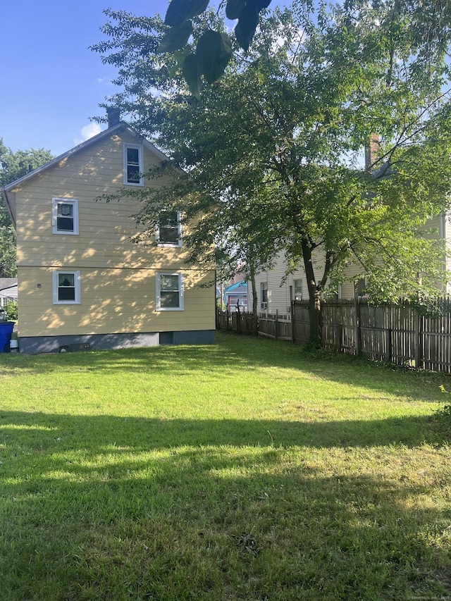 24 Daniel St, East Hartford, CT 06108 - view of property exterior featuring a chimney