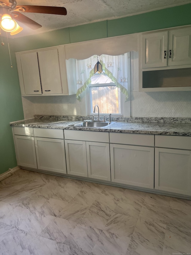 24 Daniel St, East Hartford, CT 06108 - kitchen with ceiling fan and light marble finish flooring