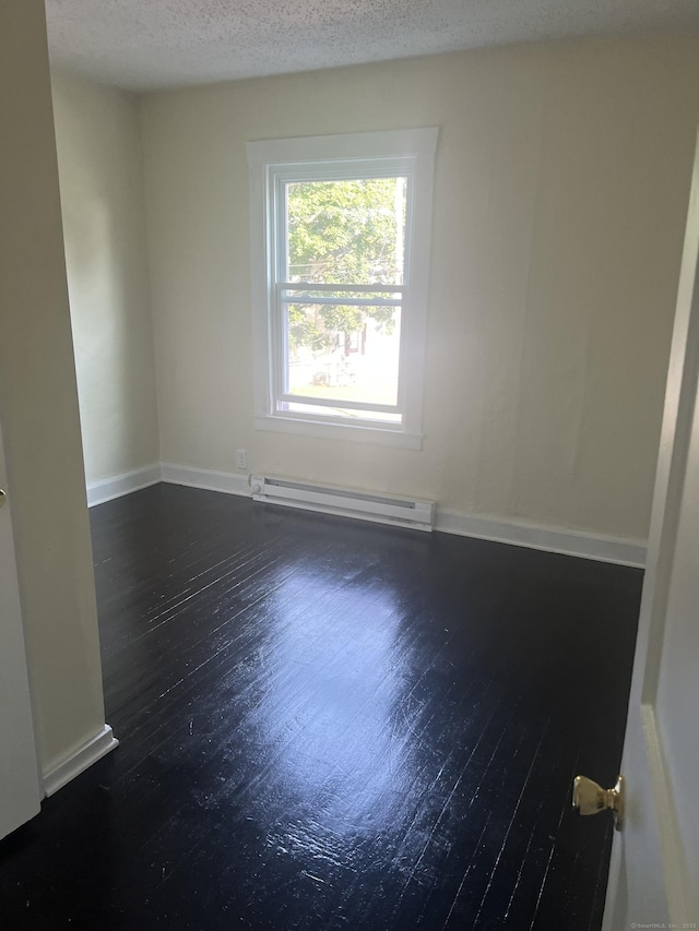 24 Daniel St, East Hartford, CT 06108 - empty room with a baseboard radiator, wood finished floors, and a textured ceiling