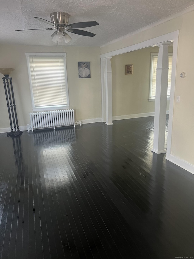 24 Daniel St, East Hartford, CT 06108 - unfurnished living room with radiator heating unit, a ceiling fan, a textured ceiling, healthy amount of natural light, and hardwood / wood-style floors