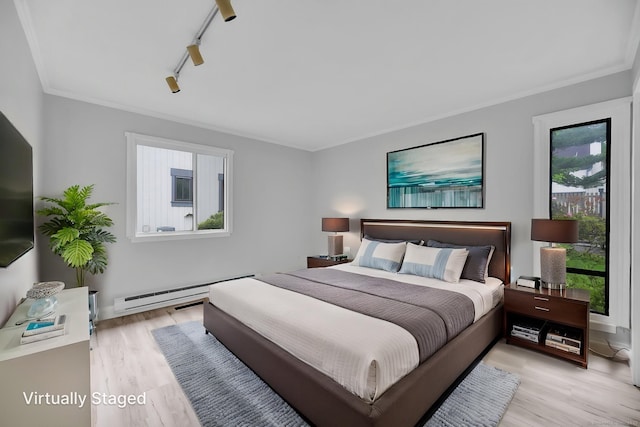 170 Heritage Vlg Unit B, Southbury, CT 06488 - bedroom with light wood finished floors, a baseboard heating unit, ornamental molding, and track lighting