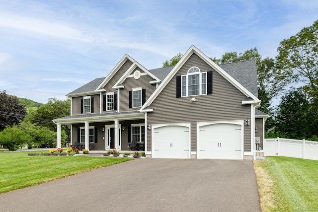 11 Mariani Dr, Southington, CT 06489 - view of front of house featuring a porch, driveway, an attached garage, and roof with shingles