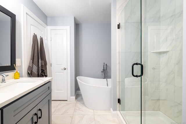 11 Mariani Dr, Southington, CT 06489 - bathroom featuring vanity, a marble finish shower, a freestanding bath, and marble finish flooring