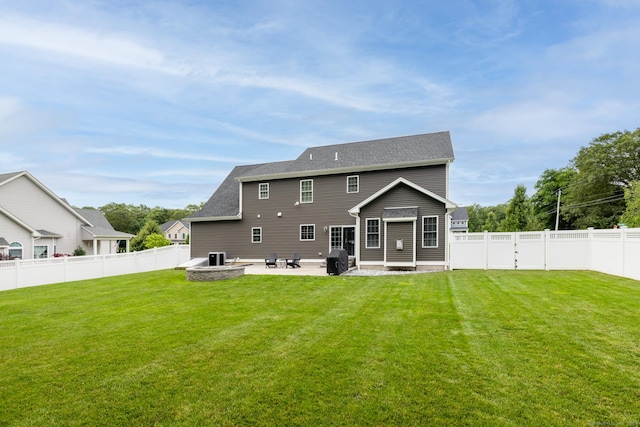 11 Mariani Dr, Southington, CT 06489 - rear view of property featuring a patio area, a fenced backyard, and an outdoor fire pit