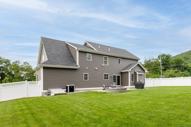11 Mariani Dr, Southington, CT 06489 - back of house featuring a fenced backyard, a patio area, and roof with shingles