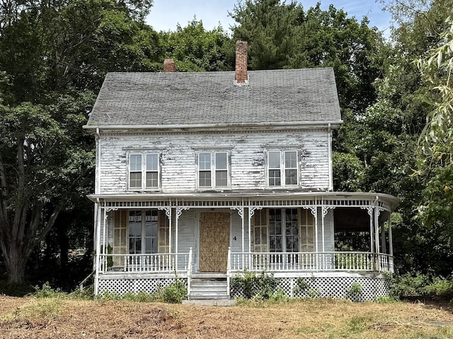 4 Bindloss Rd, Groton, CT 06355 - view of front of property with covered porch and a chimney