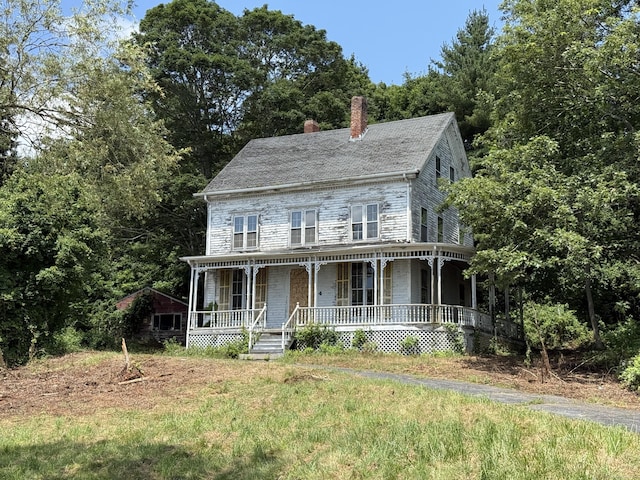 4 Bindloss Rd, Groton, CT 06355 - view of front of home featuring a porch, a chimney, and stone siding