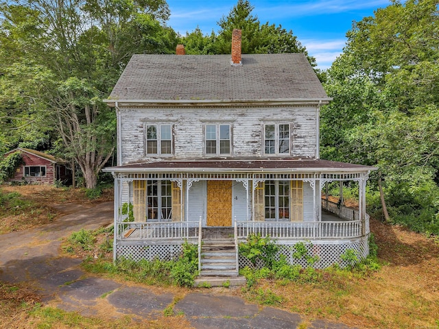 4 Bindloss Rd, Groton, CT 06355 - view of front of house featuring a chimney and covered porch