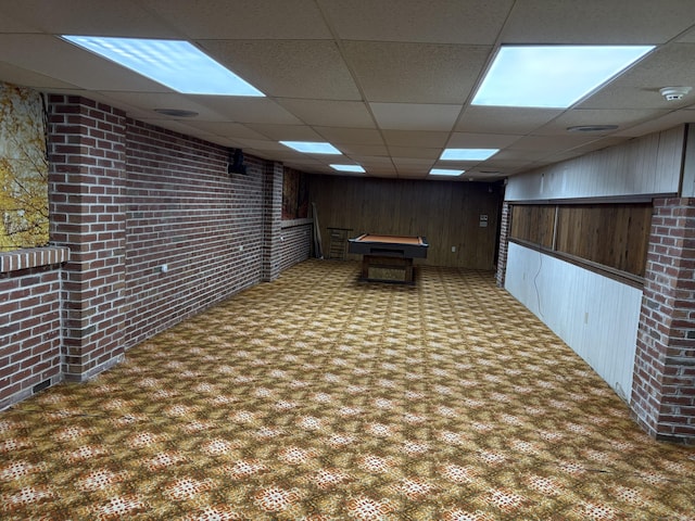 15 S Meadow Dr, Danbury, CT 06811 - finished below grade area featuring a paneled ceiling, wooden walls, pool table, brick wall, and carpet