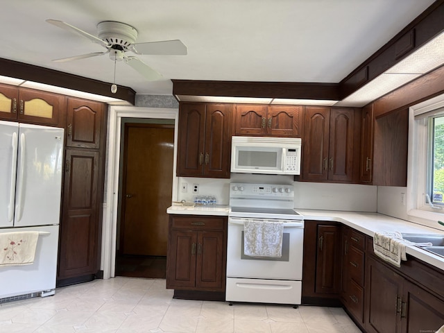 15 S Meadow Dr, Danbury, CT 06811 - kitchen with white appliances, light countertops, ceiling fan, and dark brown cabinetry