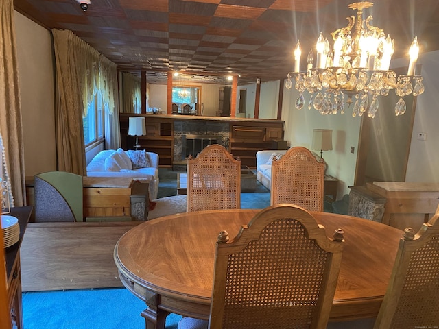 15 S Meadow Dr, Danbury, CT 06811 - dining area featuring carpet floors, a fireplace, and a chandelier